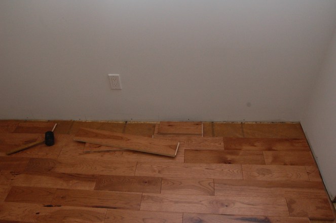 Hickory wood floors in the LR - almost done in this photo and now complete. March 2013
